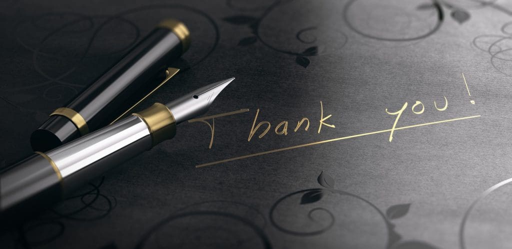 Act Happy Week, Day 3: 3D illustration of a gratitude message over black background. Thank you written in golden letters.